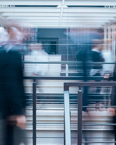 business-people-talking-in-corridor-PSVCLEM(1)